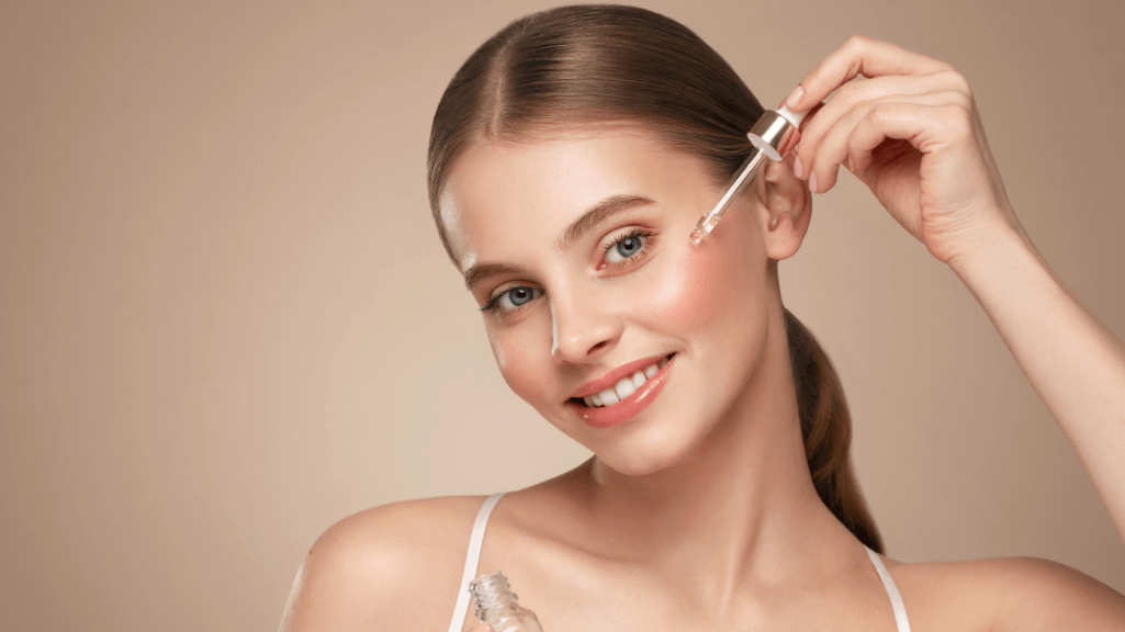 Woman applying retinol serum as routine