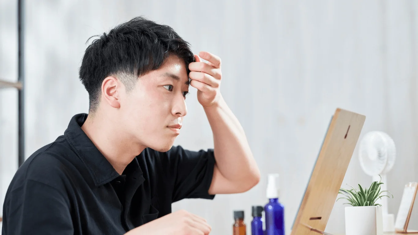 men apply skincare