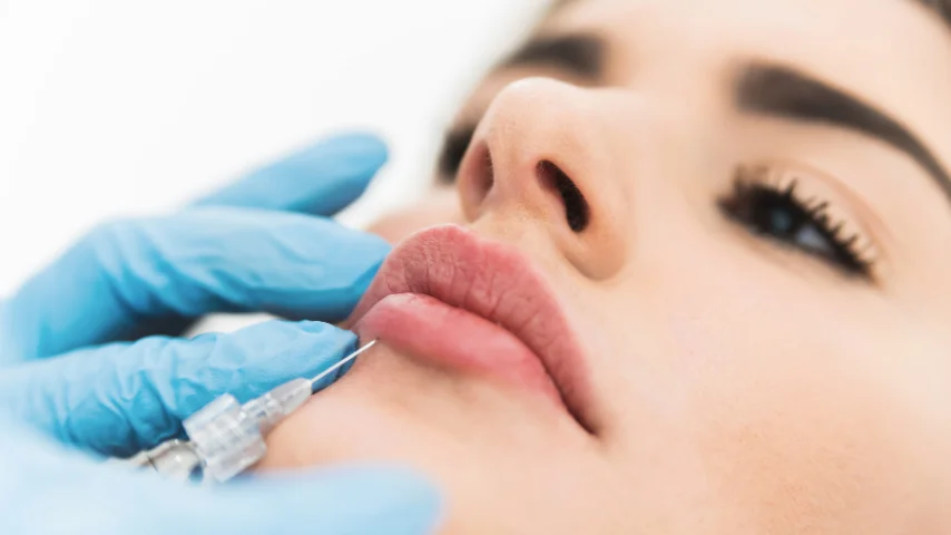 Aesthetic doctor performing dermal filler injection procedure
