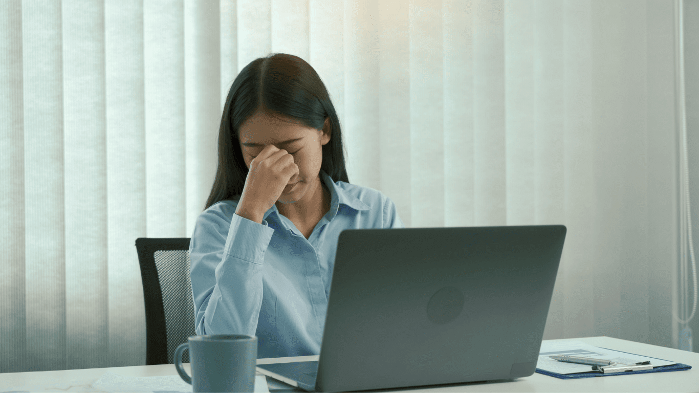Woman experiencing eye strain from screen time