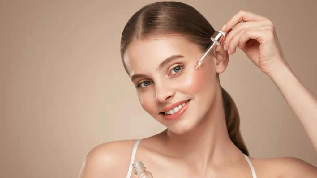 Woman applying retinol serum as routine