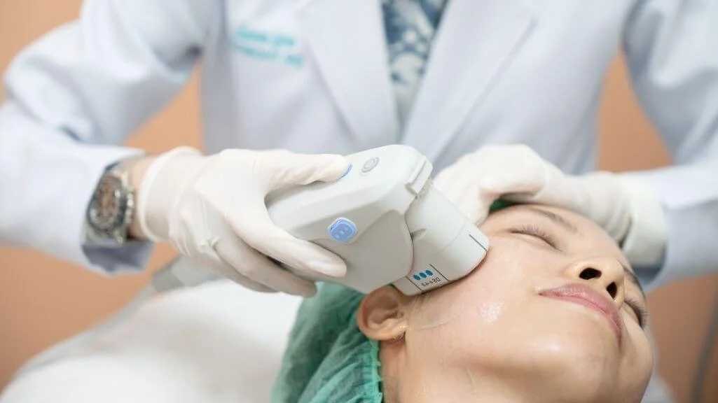 Woman undergoing HIFU treatment for a V-shaped facial contour